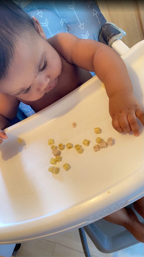 Photo of a toddler eating a meal