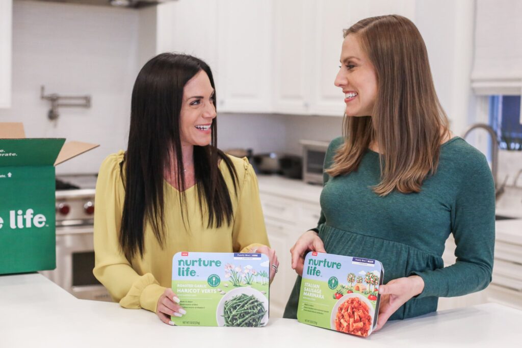 two women with Nurture Life meals